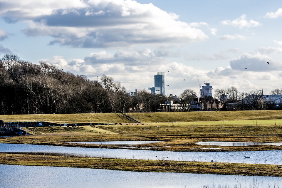 Environment Agency Salford flood improvement scheme with industry buildings in background
