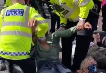 Extinction Rebellion protesters resist police efforts to lift them off streets in London | UK | News (Reports)