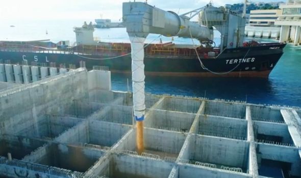 Land grab: Giant concrete blocks have been filled with sand that create the land's base