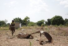 Preventing famine in communities affected by conflict A young girl walks on the grounds around the church in Yei, South Sudan. (UN Photo)