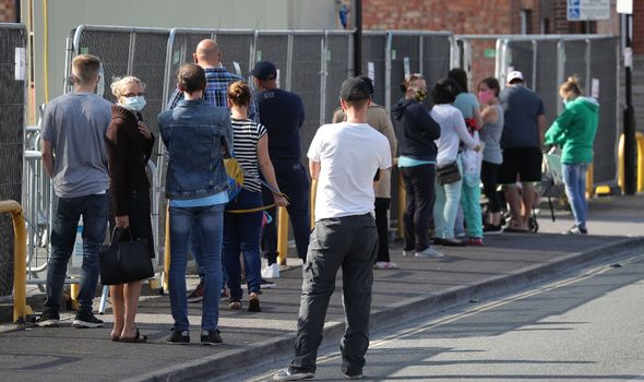 People queue up outside a walk through coronavirus testing centre on Marlborough Road in Southampton People queue up outside a walk through coronavirus testing centre on Marlborough Road in Southampton