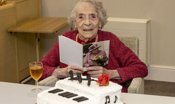 Joan with her birthday card from the Queen