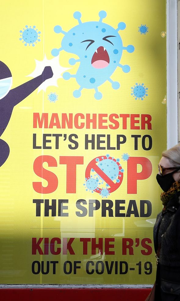 A Covid-19 sign on Deansgate in Manchester