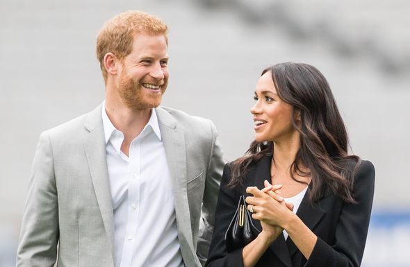 Prince Harry and Meghan Markle smiling Prince Harry and Meghan Markle smiling
