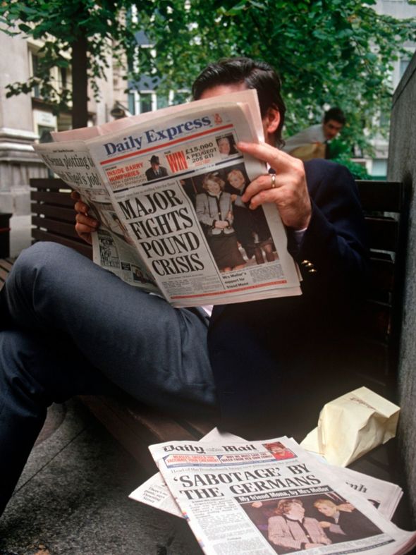 UK politics: A man reads about the news of Major's blunder in a copy of the Daily Express, 1992 UK politics: A man reads about the news of Major's blunder in a copy of the Daily Express, 1992