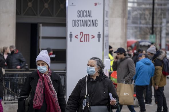 Pedestrians wearing masks Pedestrians wearing masks