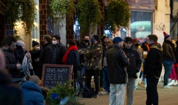 London news: Drinkers queue for a cold beer at the White Hart in New Cross, South London