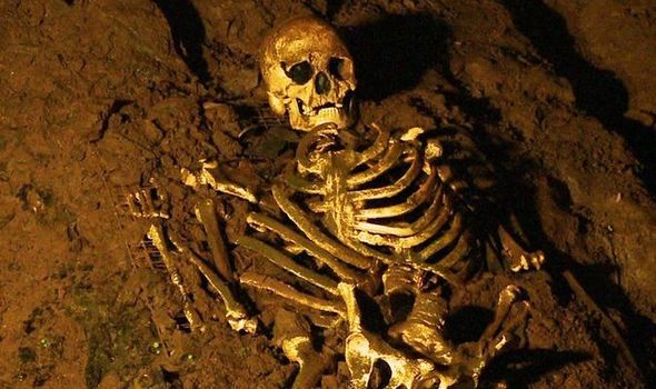 A replica of the Cheddar Man has been placed back in the cave