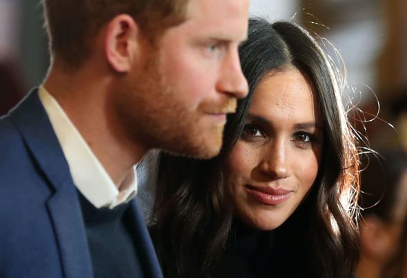 Meghan Markle looking at the camera near Prince Harry Meghan Markle looking at the camera near Prince Harry